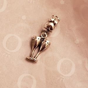 Pandora champagne toast charm with hearts.